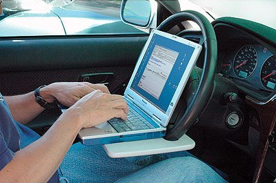 laptop-steering-wheel-desk-in-use laptop-steering-wheel-desk-in-use